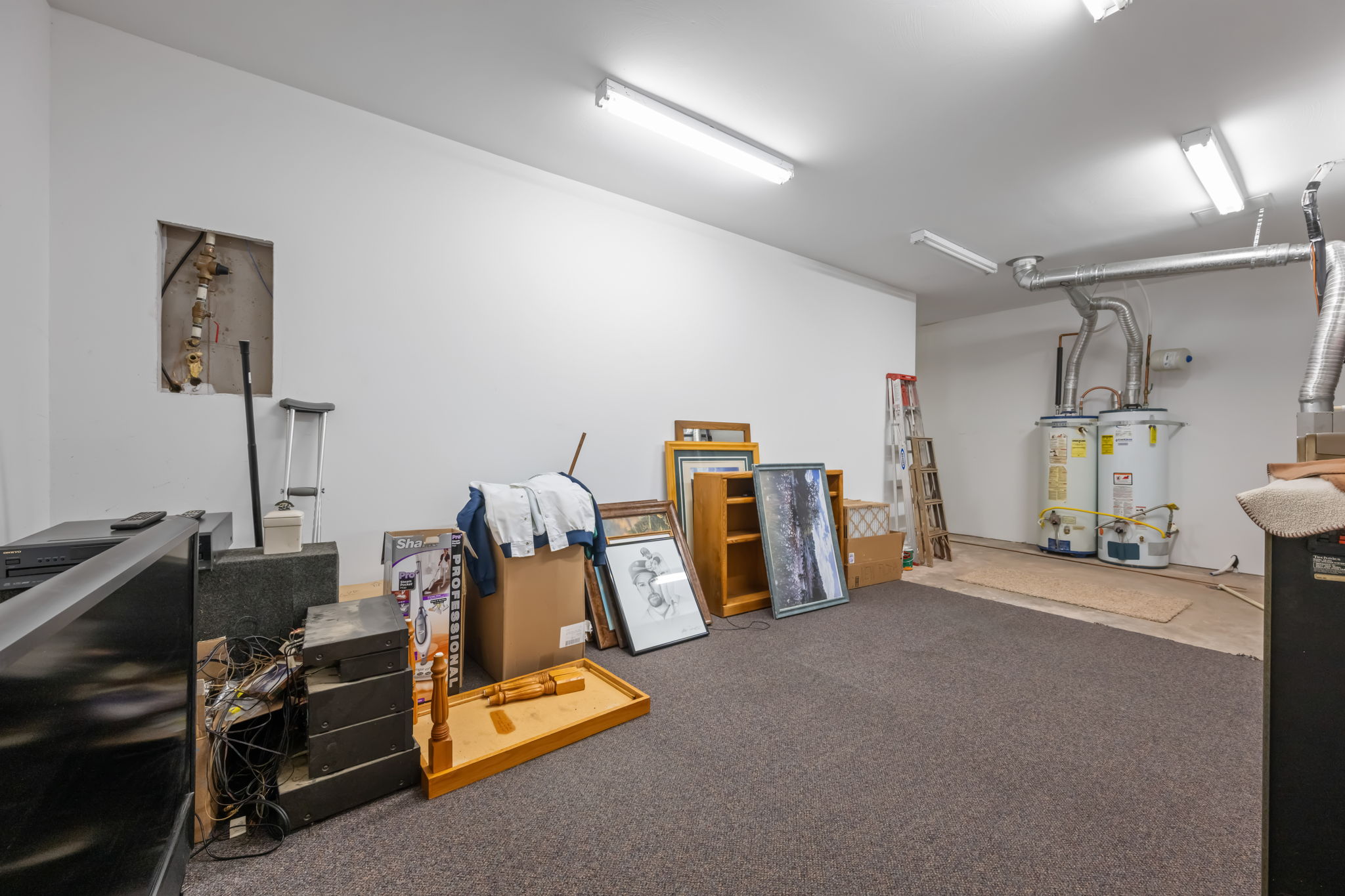 Misc room featuring secured water heater