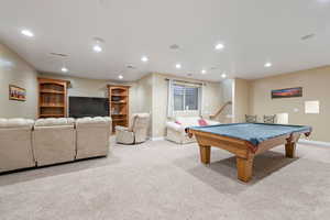 Recreation room featuring light colored carpet, recessed lighting, and billiards