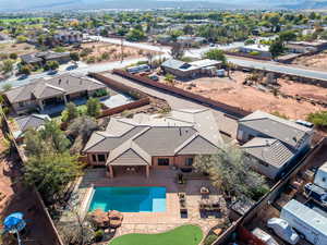 Aerial perspective of suburban area featuring a pool