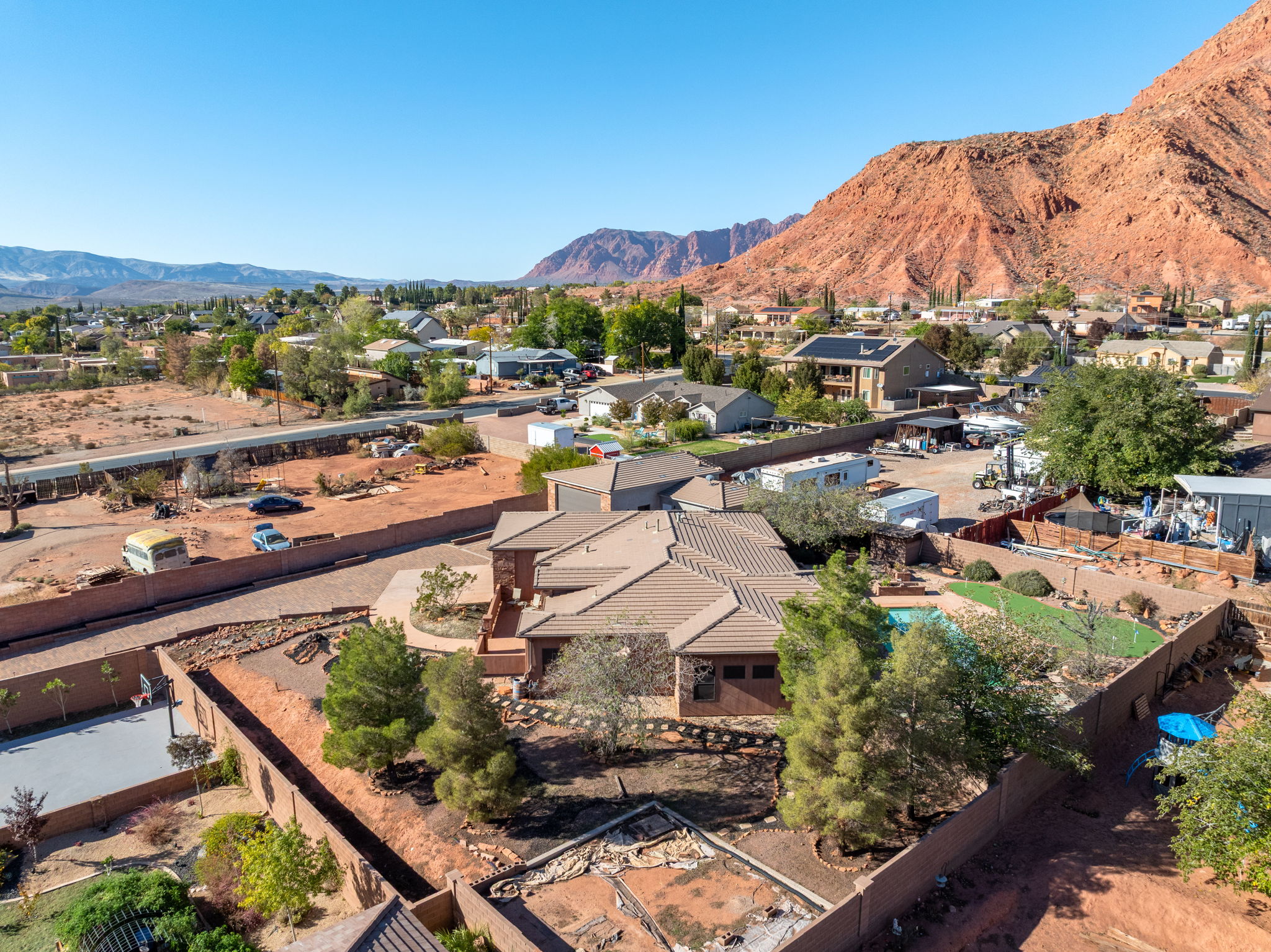 Aerial perspective of suburban area featuring a mountainous background