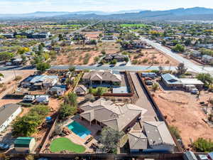 Aerial perspective of suburban area featuring a mountain backdrop