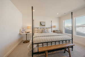 Bedroom featuring light colored carpet and recessed lighting