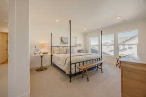 Bedroom featuring light colored carpet and recessed lighting