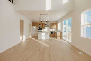 Unfurnished living room featuring light wood-style floors and recessed lighting