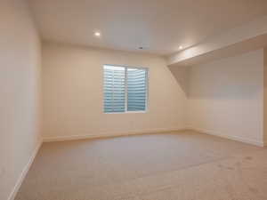 Spare room with light carpet and recessed lighting