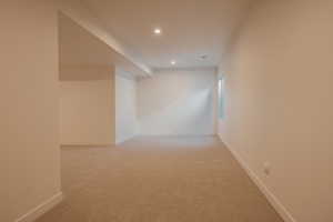 Bonus room featuring light carpet and recessed lighting