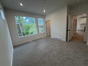 Unfurnished bedroom featuring recessed lighting and light colored carpet