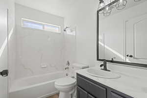 Bathroom featuring vanity and shower / washtub combination
