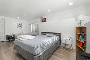 Bedroom with recessed lighting and light wood-style flooring