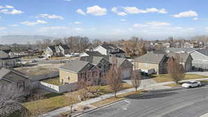 Aerial perspective of suburban area with a mountainous background