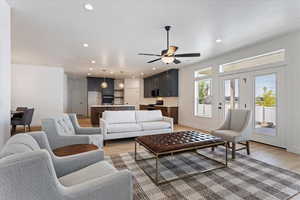Living area featuring light wood-type flooring, recessed lighting, and ceiling fan