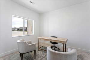 Home office featuring carpet floors
