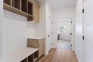 Mudroom with light wood finished floors