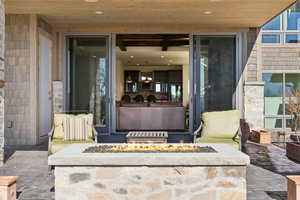 View of exterior entry featuring a patio area