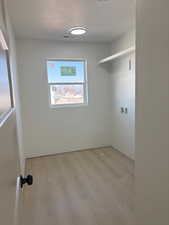 Laundry room featuring light wood-style floors and washer hookup