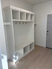 Mudroom with light wood finished floors