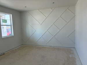 Unfurnished room featuring baseboards
