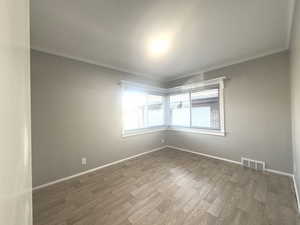 (#3) Bedroom, crown molding, large  window for lots of natural light, floating floor.
