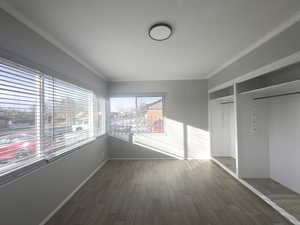 (#2) Primary Bedroom/Office, crown molding, lots of windows, floating floor.