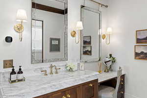 Bathroom with vanity and crown molding