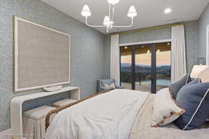 Bedroom featuring wallpapered walls, access to exterior, and recessed lighting