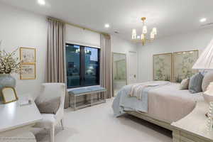 Bedroom with carpet floors and a chandelier