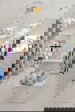 Walk in closet featuring light carpet and a chandelier