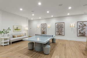 Rec room featuring light wood-type flooring and recessed lighting