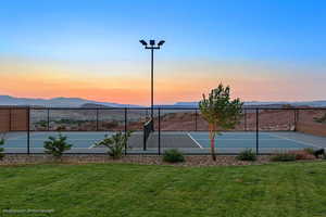 View of tennis court featuring a mountain view