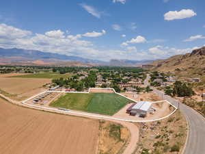 Overview of rural landscape with a mountainous background and property boundaries highlighted