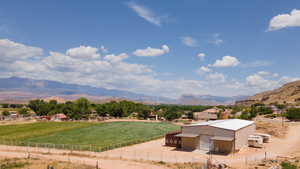 View of mountain backdrop with rural landscape