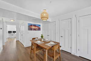 Dining space with wood finished floors