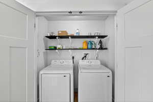 Laundry area featuring washing machine and clothes dryer