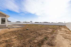 View of fenced backyard