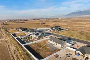 Aerial view of sparsely populated area featuring nearby suburban area
