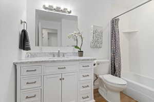 New vanities and toilets, + bath with a cultured marble tub surround and upgraded granite vanity top.