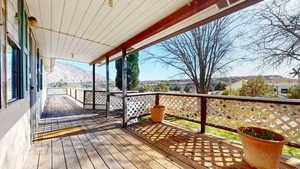 Covered deck has beautiful, wide-open views.
