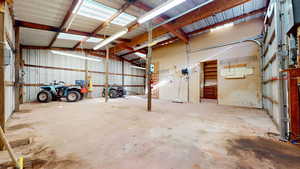 Workshop has 220v power, water, concrete floor and drive & a bathroom.