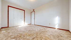 Main bedroom on level 1 with attached bath.