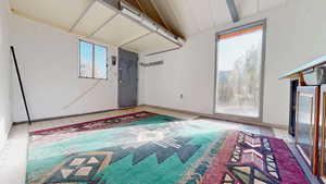 She-shed has light filled interior with loft plus water & power.