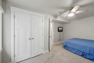 Bedroom with carpet and ceiling fan