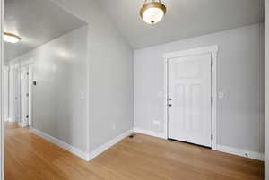 Entryway featuring a textured ceiling and light wood-type flooring