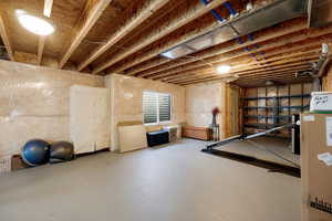Workout area featuring finished concrete flooring