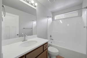 Bathroom featuring shower / bathtub combination and vanity