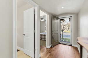 Entryway featuring a barrel ceiling, hardwood / wood-style flooring, and a ceiling fan