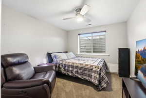 Bedroom with carpet and ceiling fan