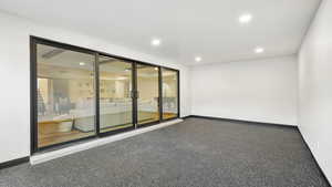 Spare room featuring baseboards and recessed lighting