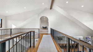 Hallway featuring beamed ceiling, light wood finished floors, and recessed lighting