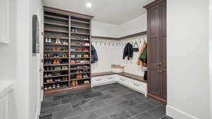 Mudroom featuring dark tile patterned flooring