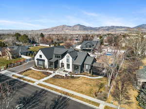 Aerial perspective of suburban area with a mountainous background